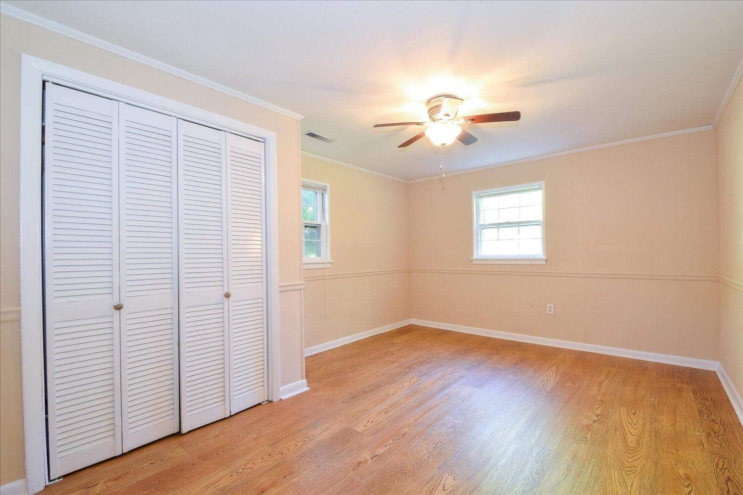 2947 Purple Finch Road Roanoke, VA 24018 - Photo 16 of 31 an empty room with wooden floor chandelier fan and windows