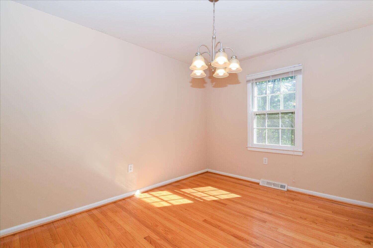2947 Purple Finch Road Roanoke, VA 24018 - Photo 5 of 31 a view of empty room with wooden floor and chandelier