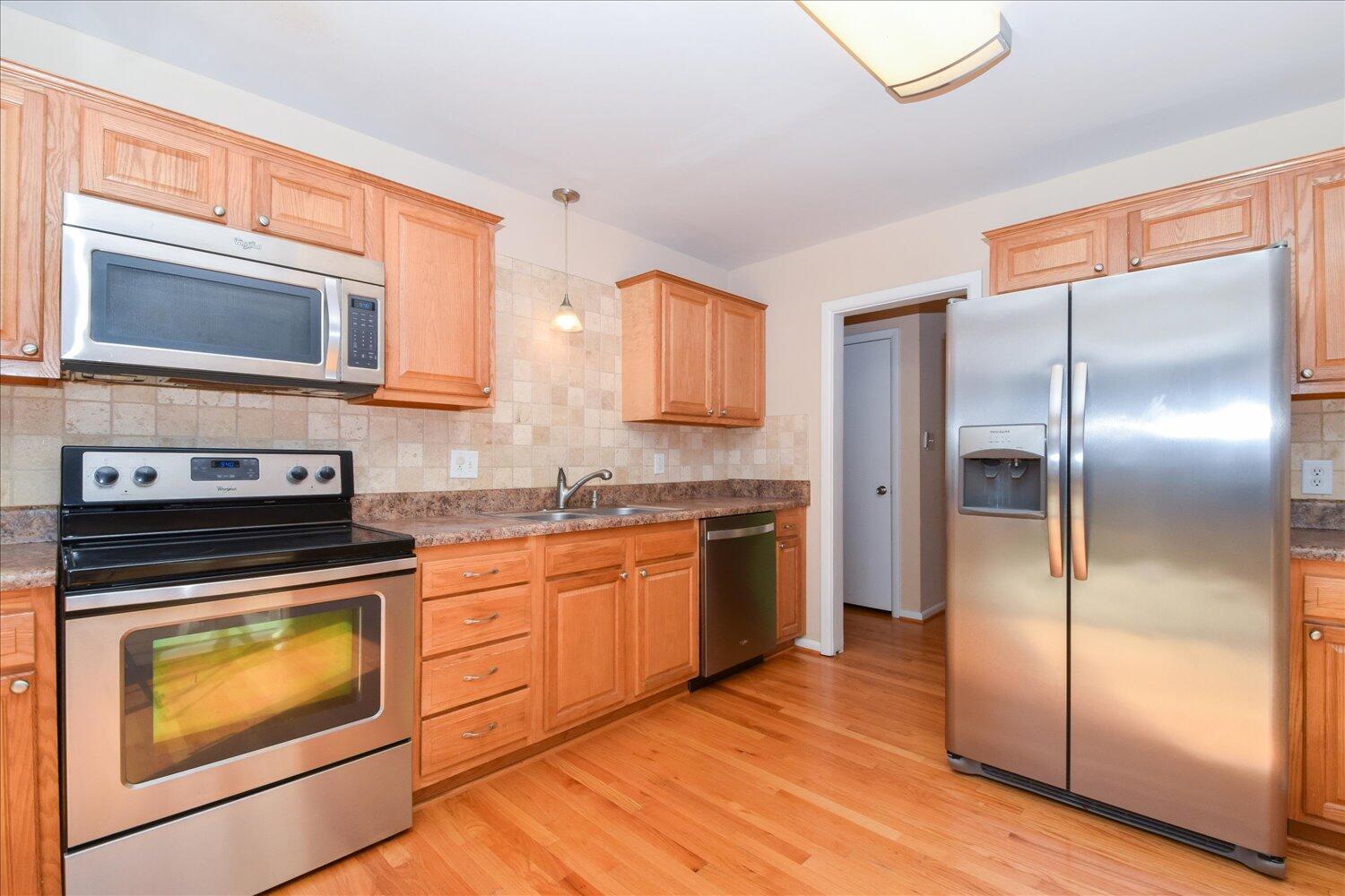 2947 Purple Finch Road Roanoke, VA 24018 - Photo 8 of 31 a kitchen with granite countertop stainless steel appliances a stove top oven