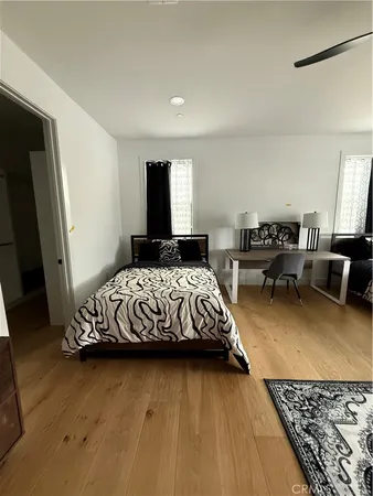 a bedroom with a bed and a couch