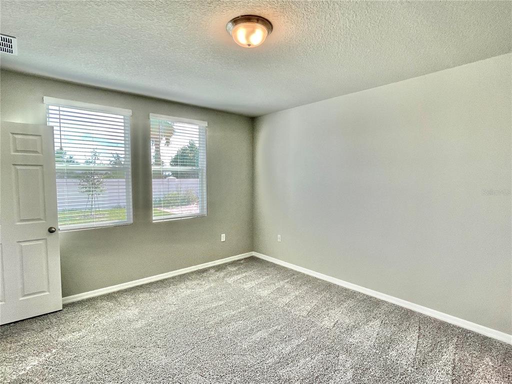 5232 Stephs Field Street St. Cloud, FL 34771 - Photo 16 of 43 an empty room with a window