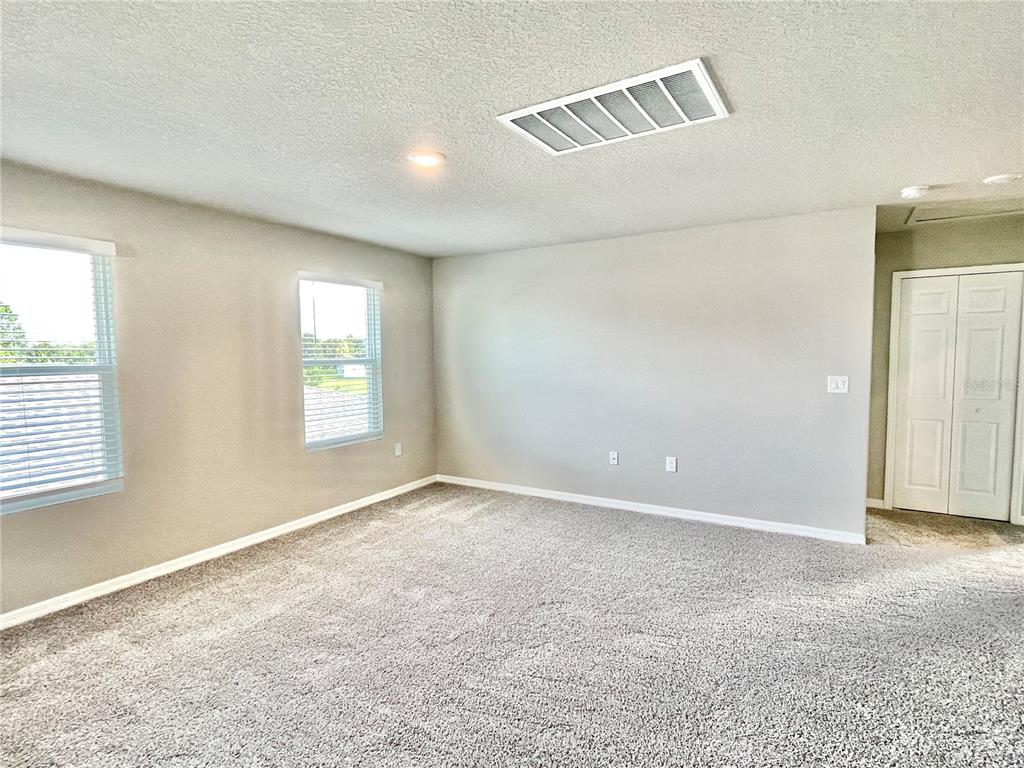 5232 Stephs Field Street St. Cloud, FL 34771 - Photo 28 of 43 an empty room with windows