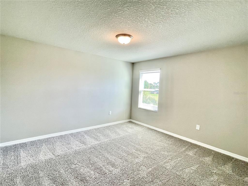 5232 Stephs Field Street St. Cloud, FL 34771 - Photo 36 of 43 an empty room with a window