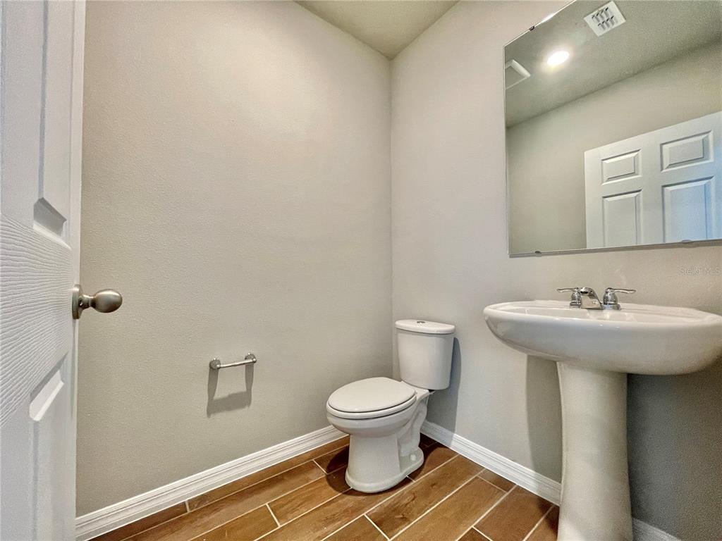 5232 Stephs Field Street St. Cloud, FL 34771 - Photo 6 of 43 a bathroom with a sink and a toilet