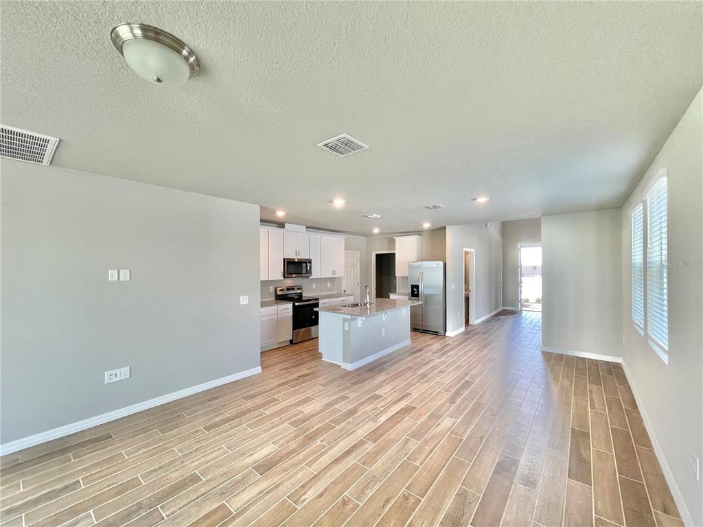5232 Stephs Field Street St. Cloud, FL 34771 - Photo 9 of 43 a view of kitchen with wooden floor
