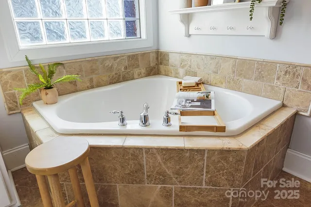 a bathroom with a bathtub and a sink