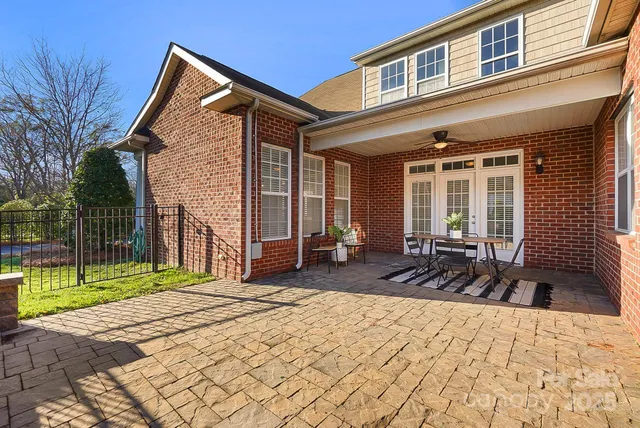 a front view of a house with a yard outdoor seating and barbeque oven
