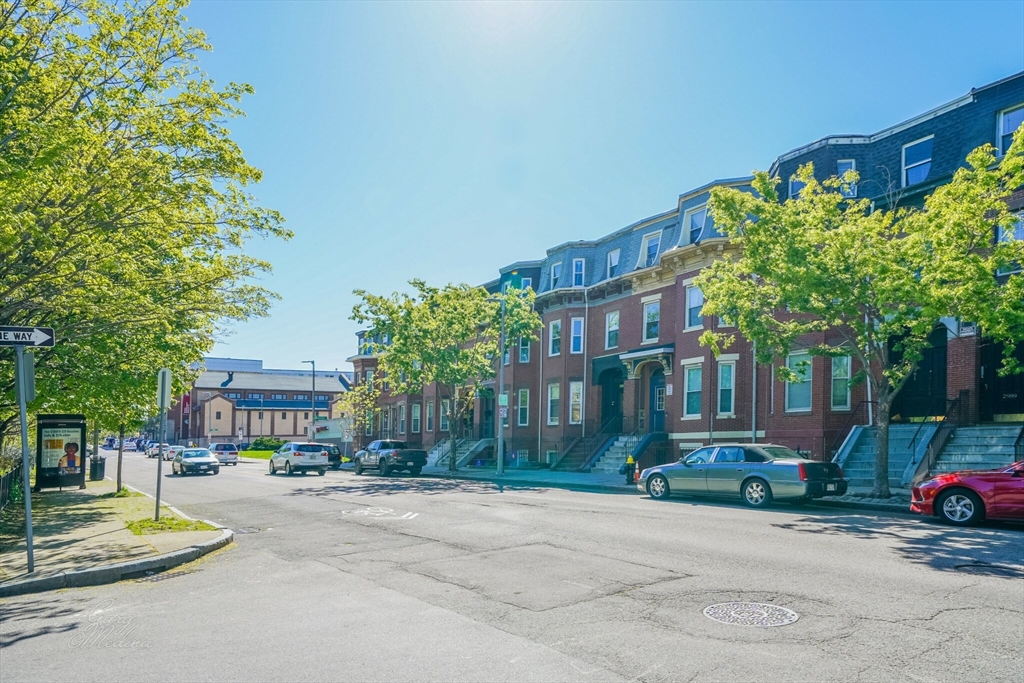 2999 Washington Street, Unit 1 Boston, MA 02119 - Photo 17 of 18 a front view of a building with tree s