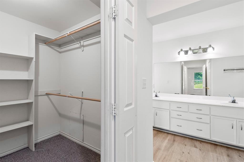 7578 Dick Price Road Mansfield, TX 76063 - Photo 14 of 40 a bathroom with a double vanity sink and mirror