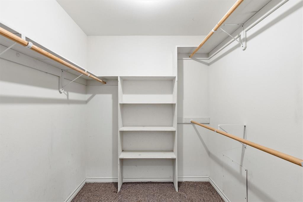 7578 Dick Price Road Mansfield, TX 76063 - Photo 16 of 40 a view of walk in closet with empty racks