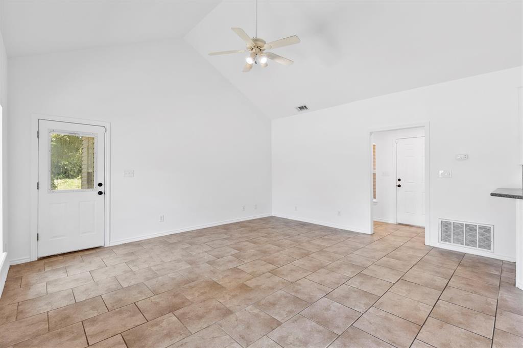 7578 Dick Price Road Mansfield, TX 76063 - Photo 20 of 40 a view of an empty room with a ceiling fan