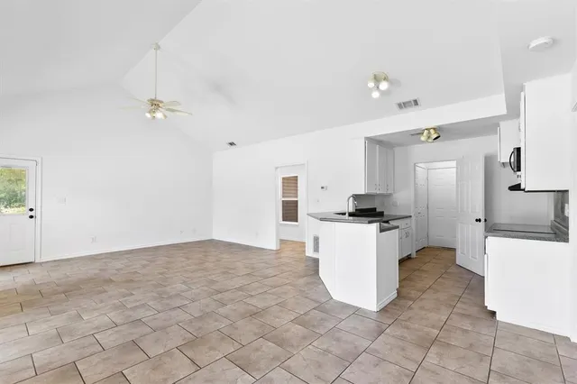 a kitchen with a refrigerator a sink and a stove