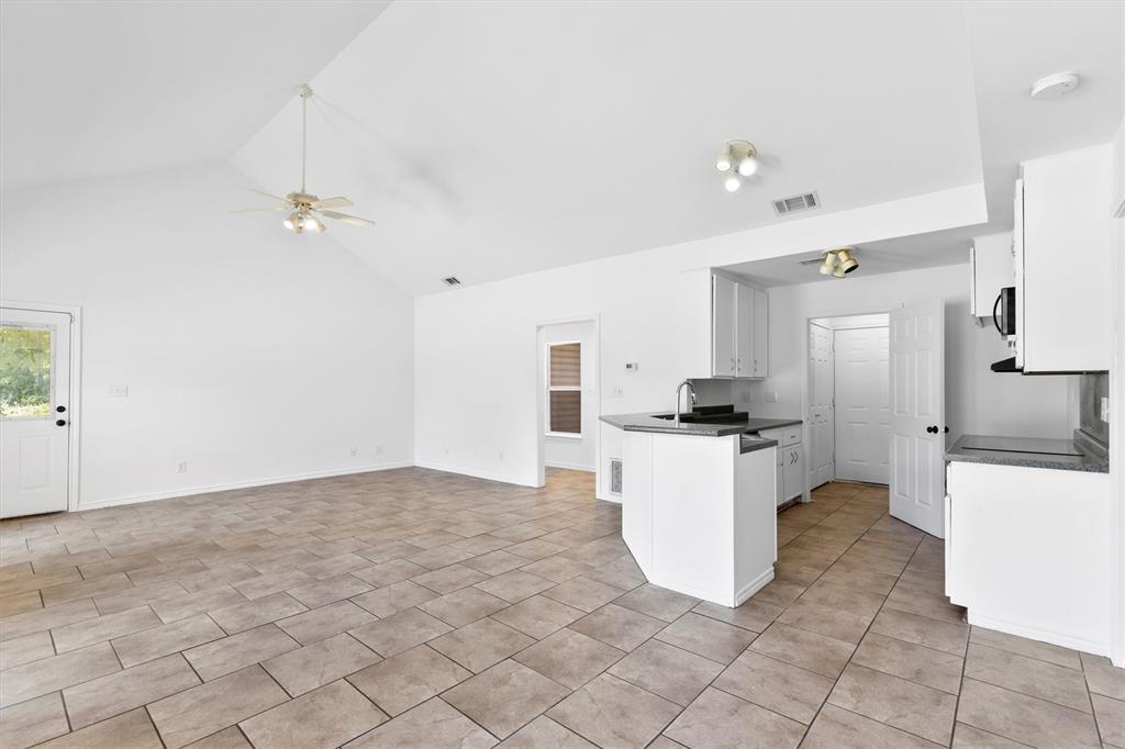 7578 Dick Price Road Mansfield, TX 76063 - Photo 21 of 40 a kitchen with a refrigerator a sink and a stove