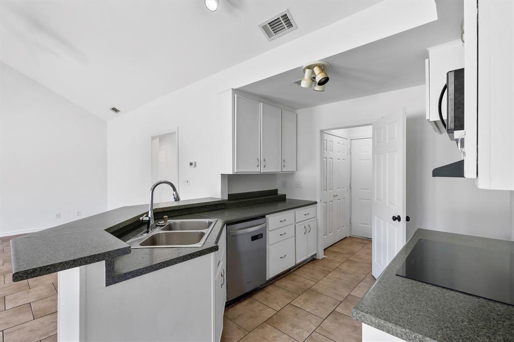 7578 Dick Price Road Mansfield, TX 76063 - Photo 23 of 40 a kitchen with a sink and cabinets