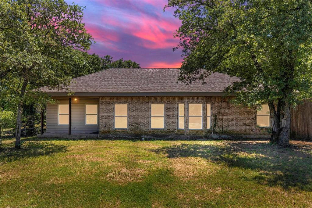 7578 Dick Price Road Mansfield, TX 76063 - Photo 30 of 40 a front view of a house with a yard