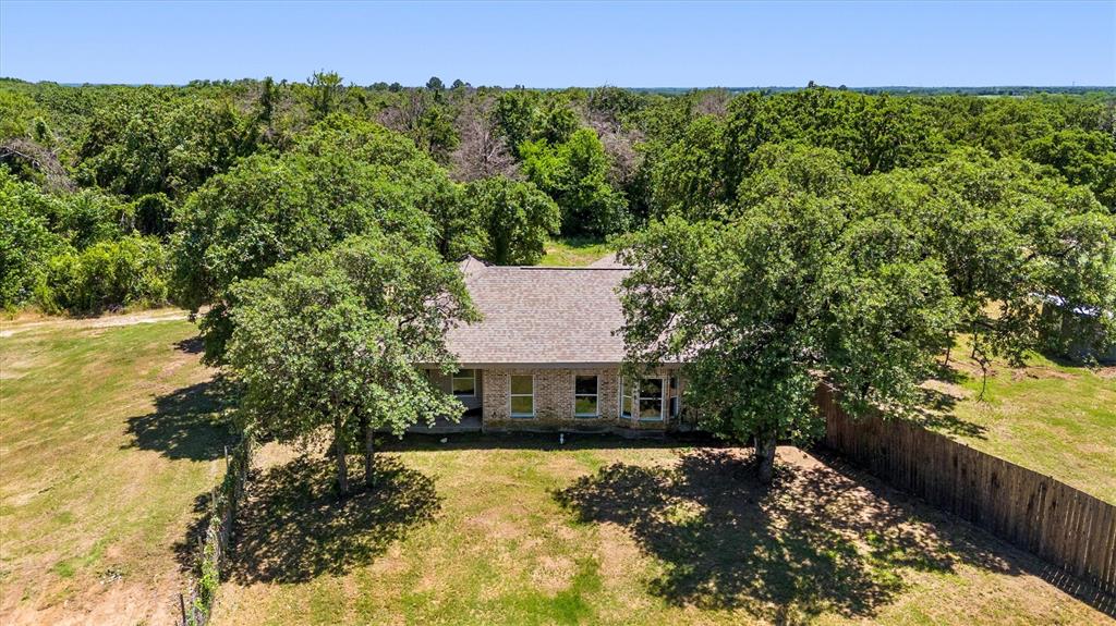 7578 Dick Price Road Mansfield, TX 76063 - Photo 34 of 40 a view of a house with a yard and a large tree