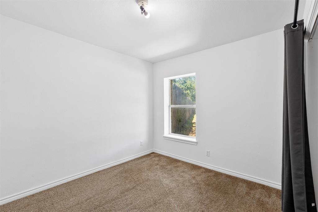 7578 Dick Price Road Mansfield, TX 76063 - Photo 4 of 40 an empty room with windows