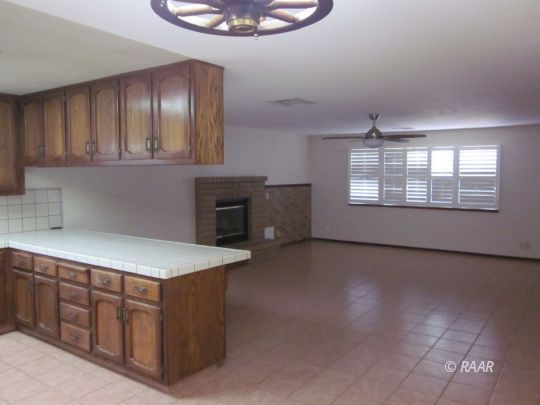 330 East Wilson Avenue Ridgecrest, CA 93555 - Photo 9 of 29 a kitchen with stainless steel appliances granite countertop a stove a sink and a refrigerator