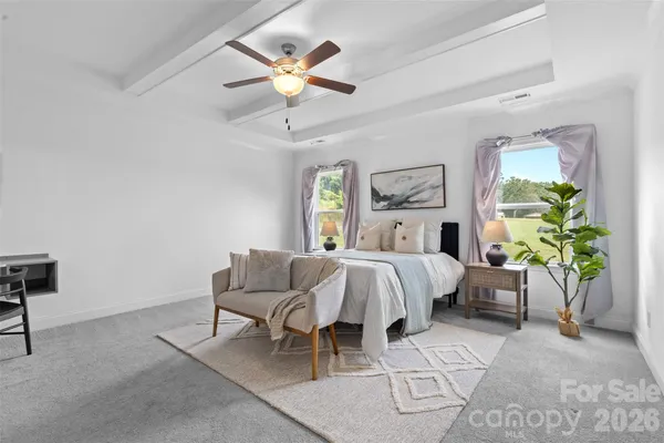 a bed room with a bed and a chandelier