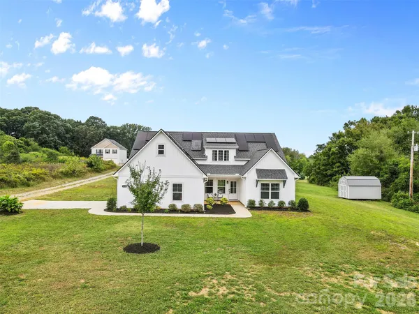 a view of a house with a big yard