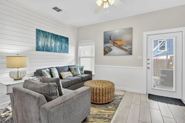 a living room with furniture and a window