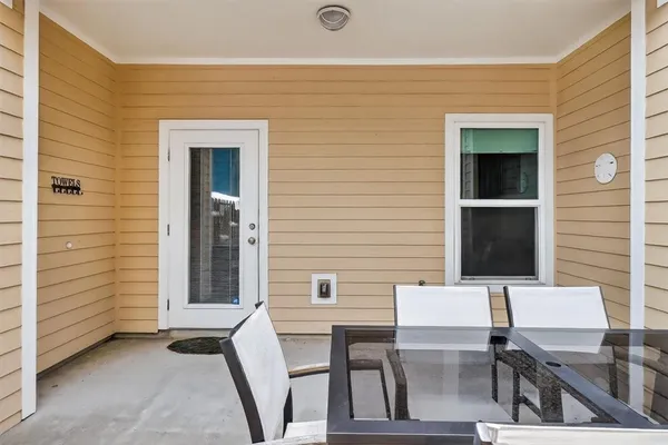 a bedroom with furniture and a lamp