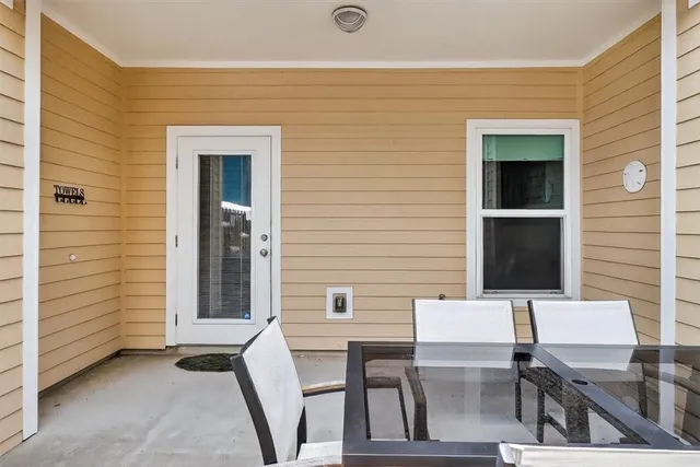 a bedroom with furniture and a lamp