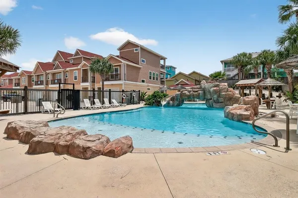 a view of a backyard with plants and patio