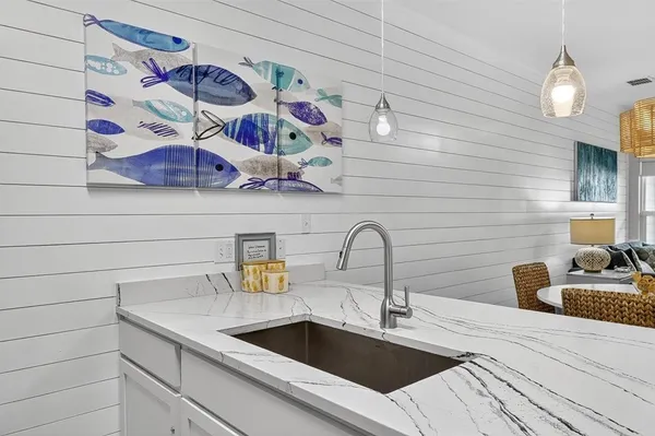 a kitchen with a sink and a stove