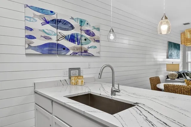 a kitchen with a sink and a stove