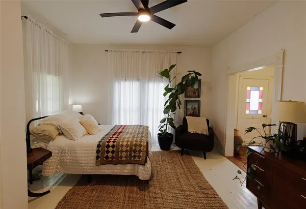 a bedroom with a bed and window