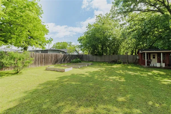 a view of a backyard with a small cabin