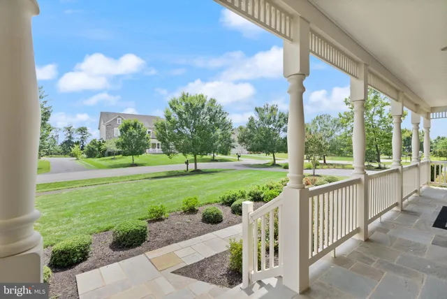 a living room with a fireplace and a flat screen tv