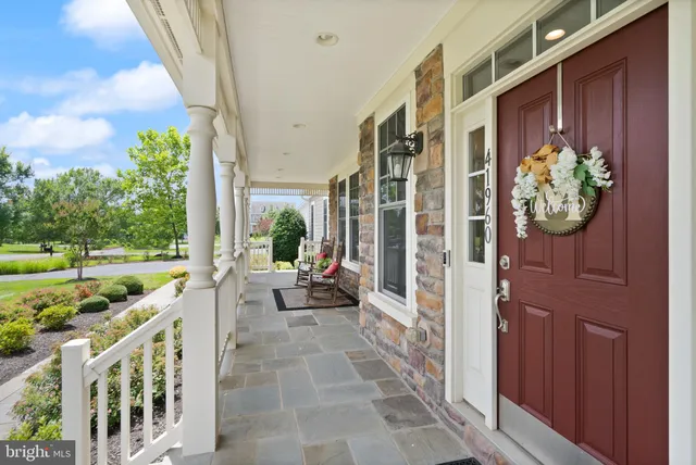 a view of a livingroom with a ceiling fan and window