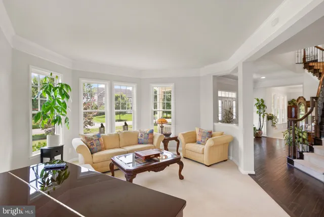 a bathroom with a granite countertop toilet a sink and a mirror