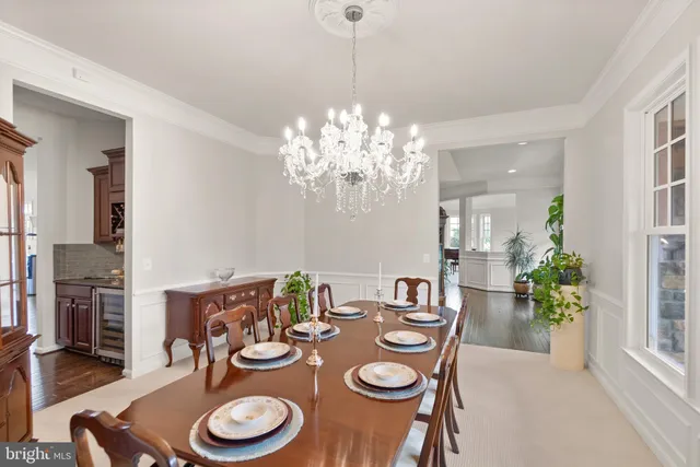 a bedroom with a bed and a flat tv screen on a dresser