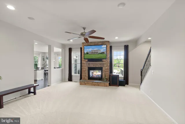 a bathroom with a granite countertop double vanity and a mirror