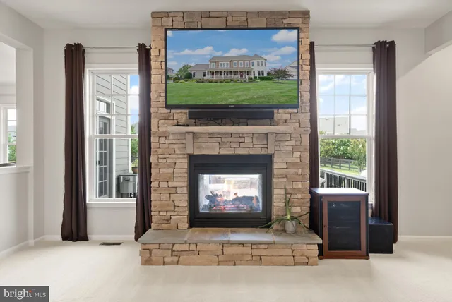a bathroom with a granite countertop sink a toilet and a mirror