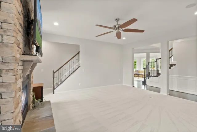 a view of walk in closet with clothes