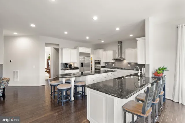 a bedroom with a large bed and a large window