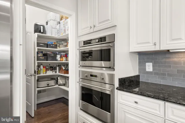 a bathroom with a sink vanity and a toilet