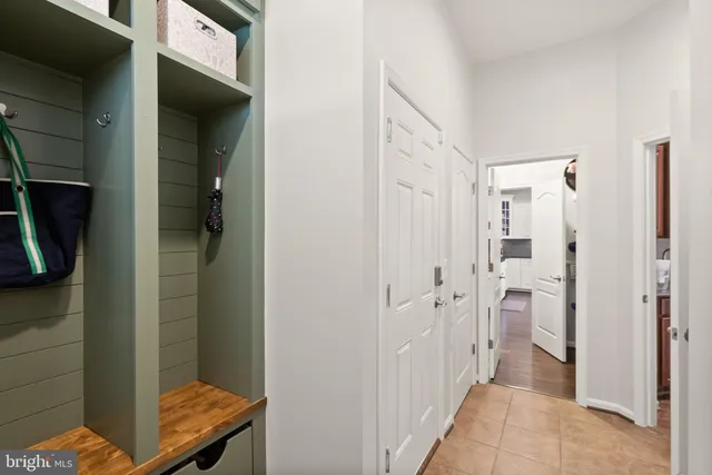 a view of walk in closet with clothes