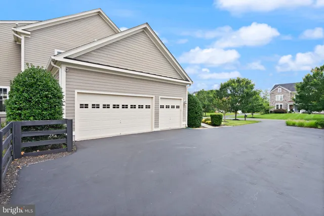 a dining room with furniture wooden floor and a chandelier
