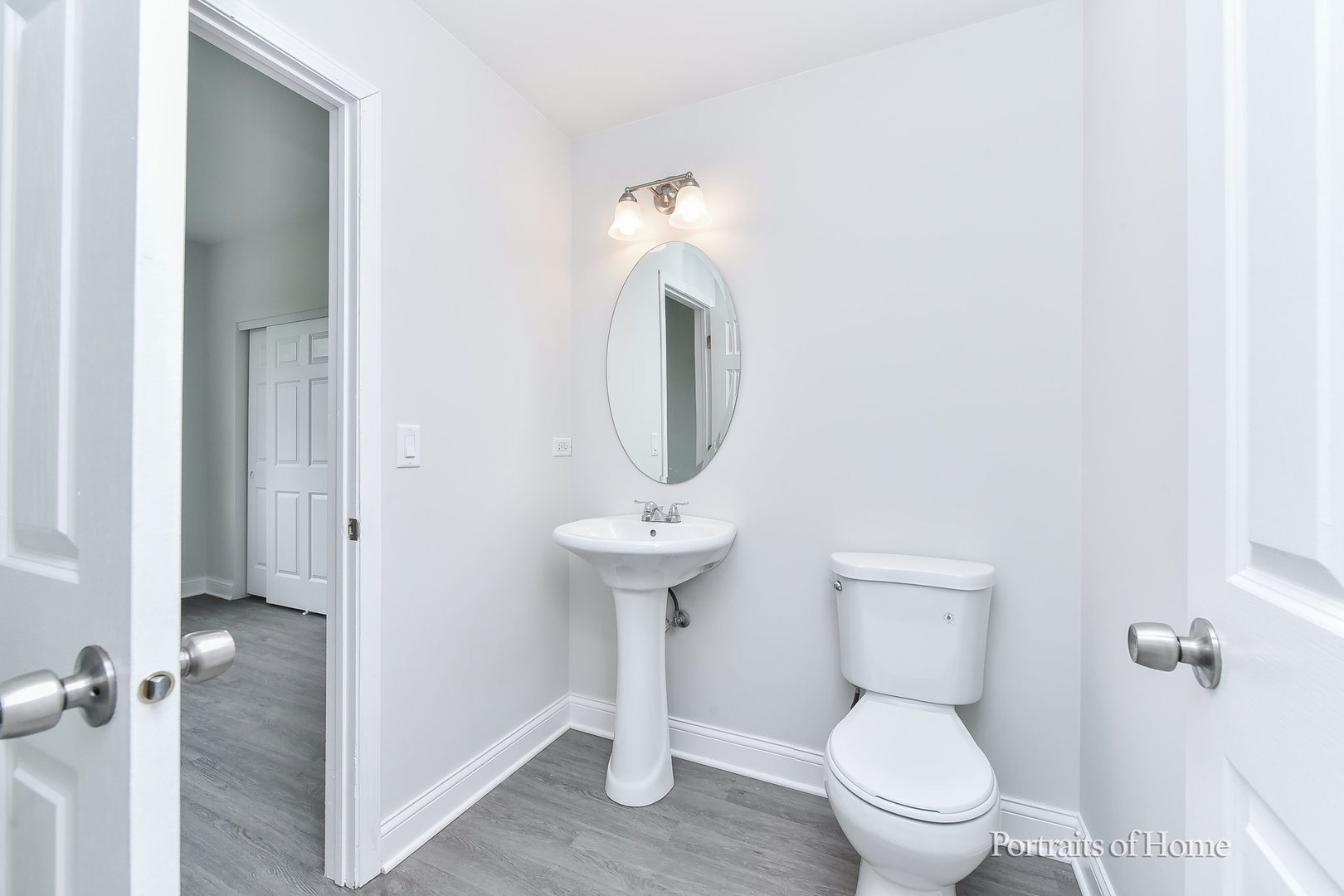 1412 Colaric Court Joliet, IL 60431 - Photo 12 of 25 a bathroom with a toilet sink and mirror