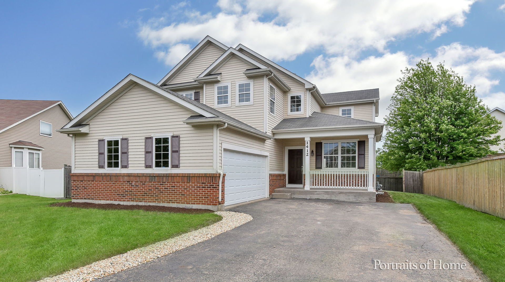 1412 Colaric Court Joliet, IL 60431 - Photo 2 of 25 a front view of a house with yard and green space