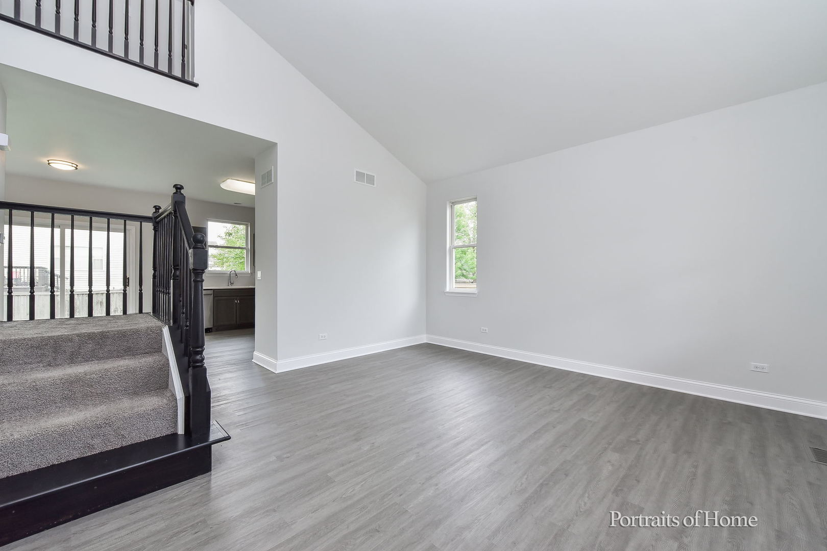 1412 Colaric Court Joliet, IL 60431 - Photo 3 of 25 a view of an empty room with wooden floor and a window