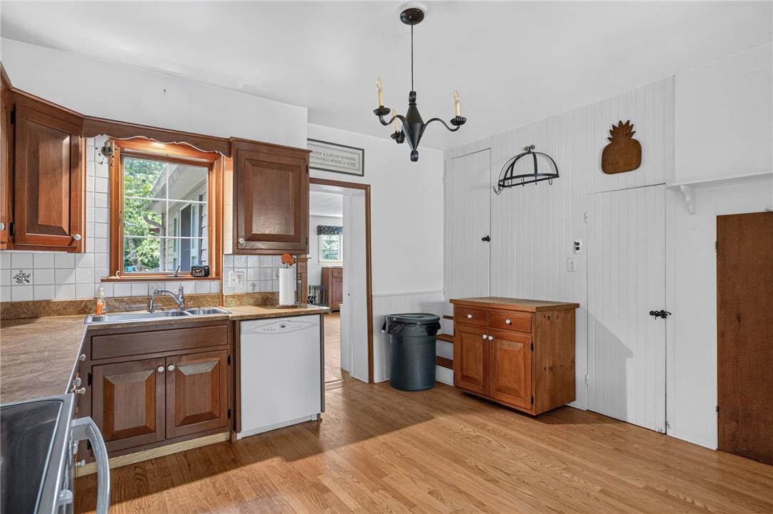 765 East Macada Road Bethlehem, PA 18017 - Photo 16 of 46 A well-lit kitchen with natural wood cabinetry and a view to the outdoors.