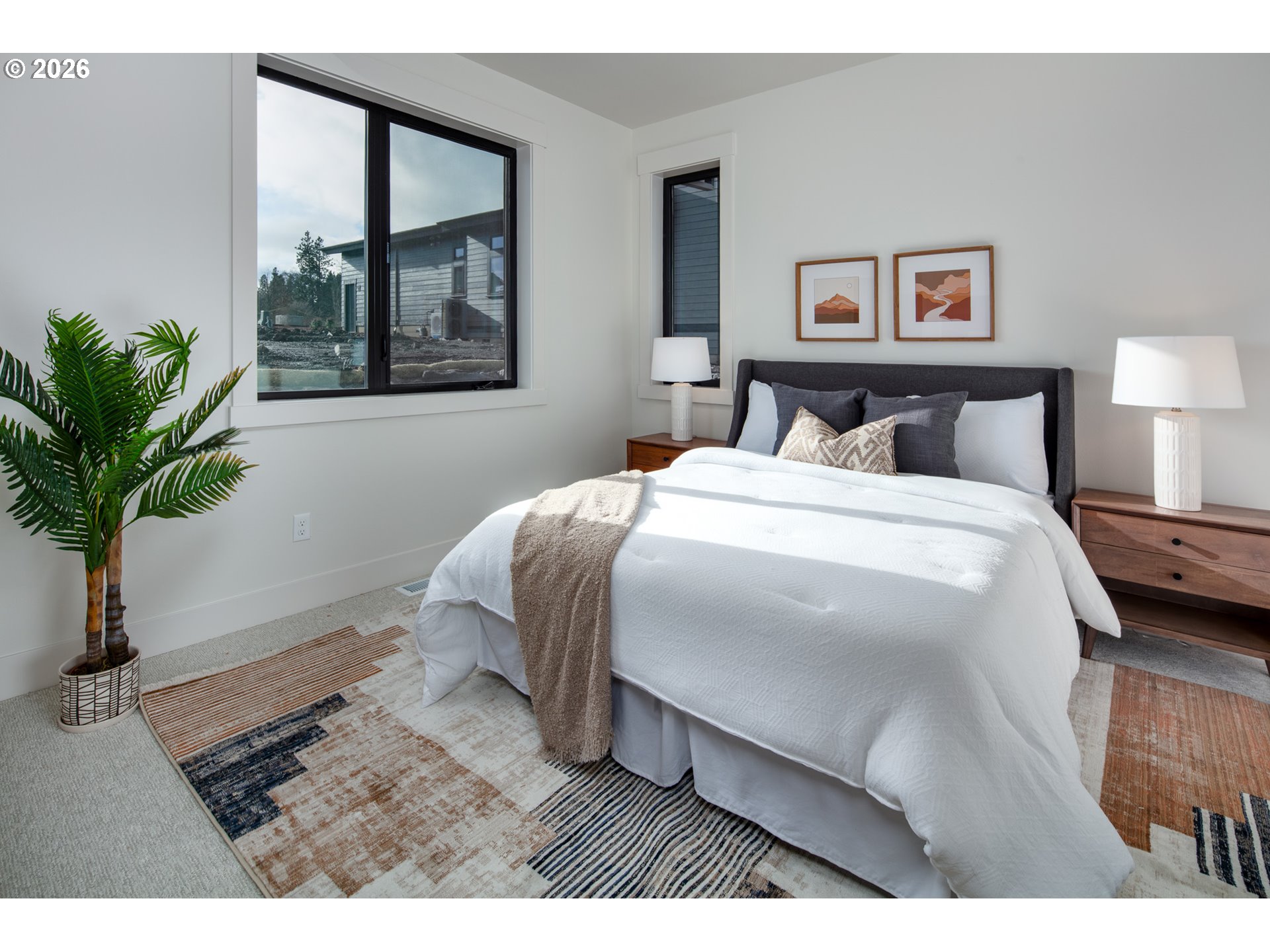 1110 Rock Creek Road Hood River, OR 97031 - Photo 10 of 16 a bedroom with a large bed and a potted plant