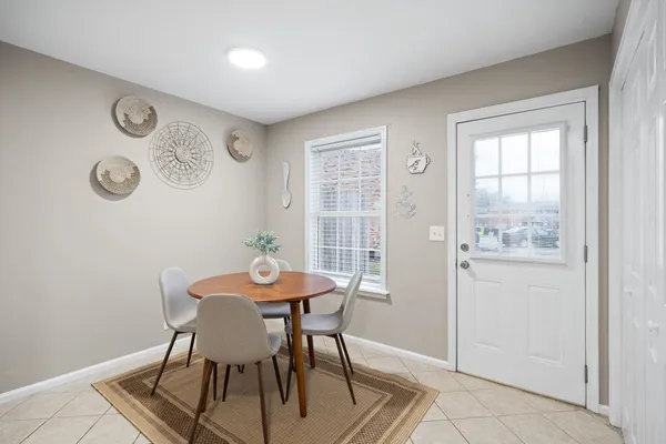 a view of a dining room with furniture and window