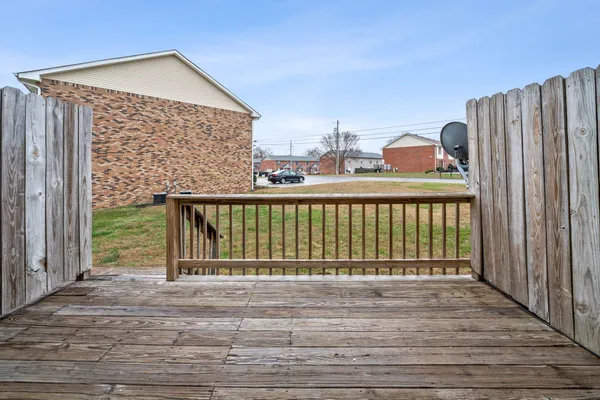 a view of outdoor space with deck and barbeque oven